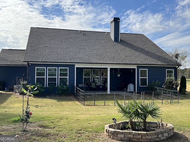 back of property featuring central air condition unit and a lawn