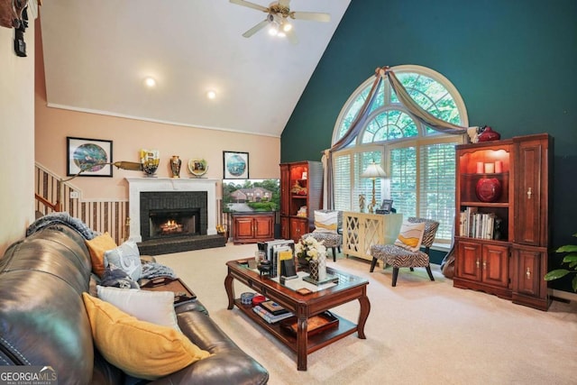 carpeted living room with a brick fireplace, high vaulted ceiling, and ceiling fan