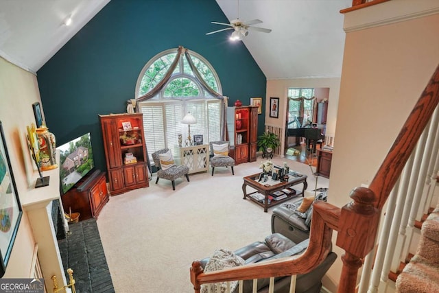 living room with carpet, ceiling fan, and high vaulted ceiling