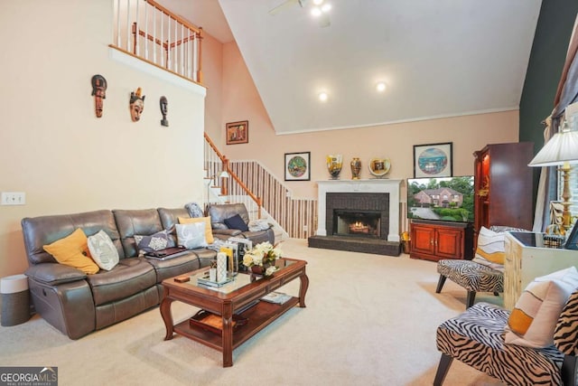 carpeted living room with high vaulted ceiling and a brick fireplace