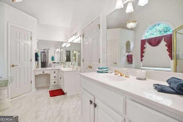 bathroom featuring vanity and vaulted ceiling