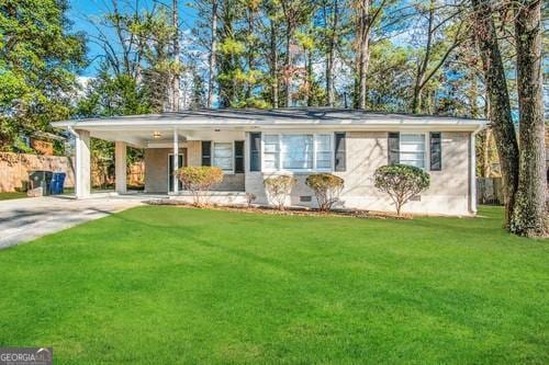 single story home with a front yard and a carport