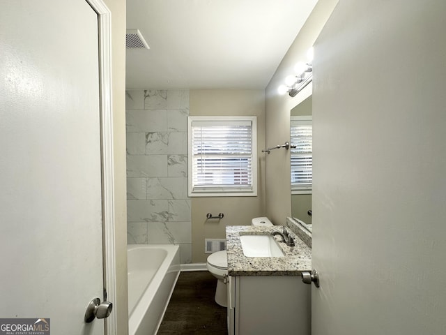 bathroom featuring hardwood / wood-style flooring, vanity, and toilet