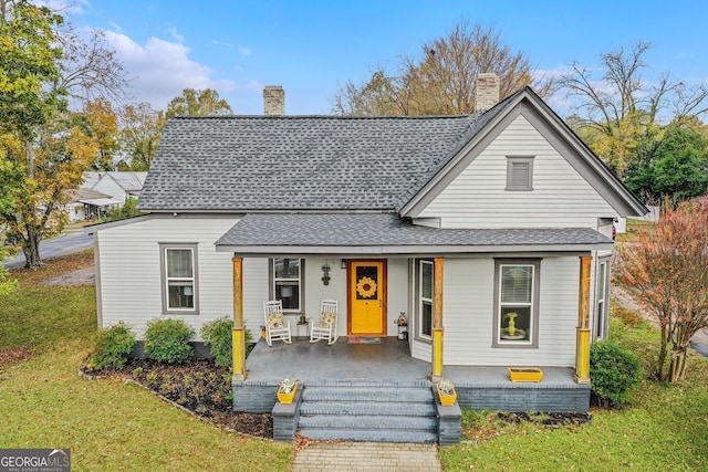 view of front of house featuring a front lawn and a porch