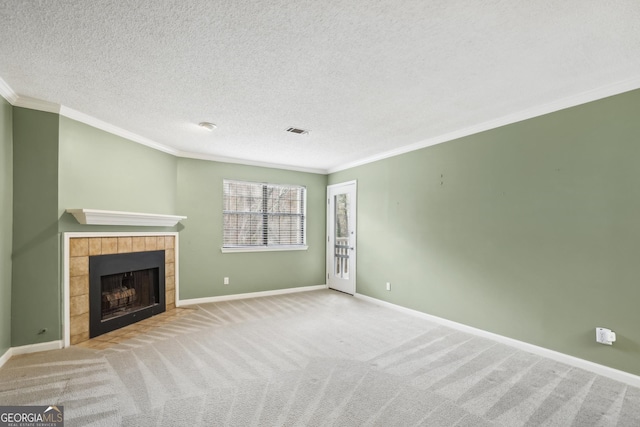 unfurnished living room with a fireplace, light colored carpet, a textured ceiling, and ornamental molding