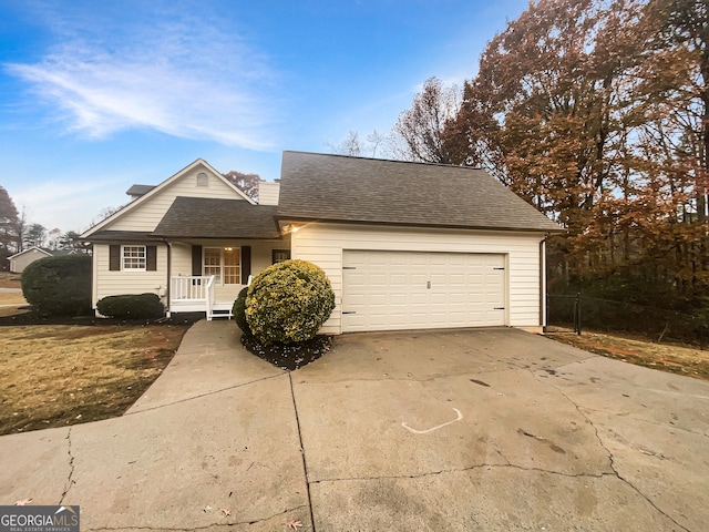 view of front of home featuring a porch and a garage