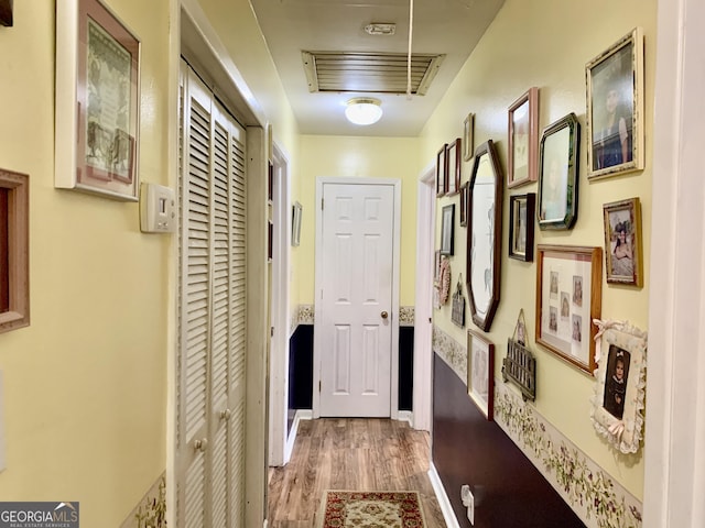 hallway featuring hardwood / wood-style flooring