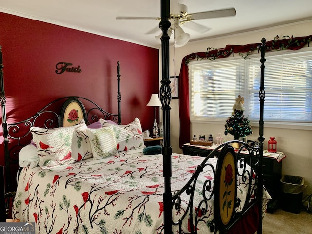 bedroom with multiple windows, carpet, ceiling fan, and ornamental molding