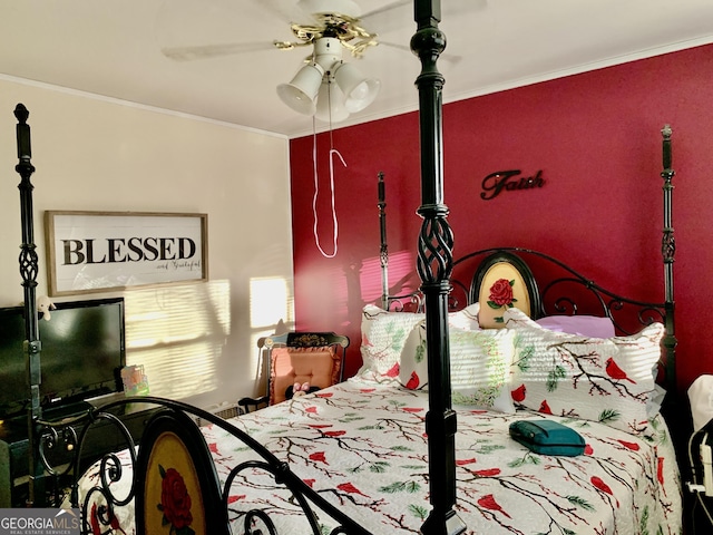 bedroom featuring ceiling fan and crown molding