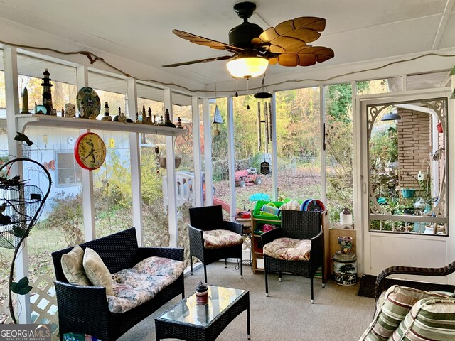 sunroom / solarium with ceiling fan and plenty of natural light