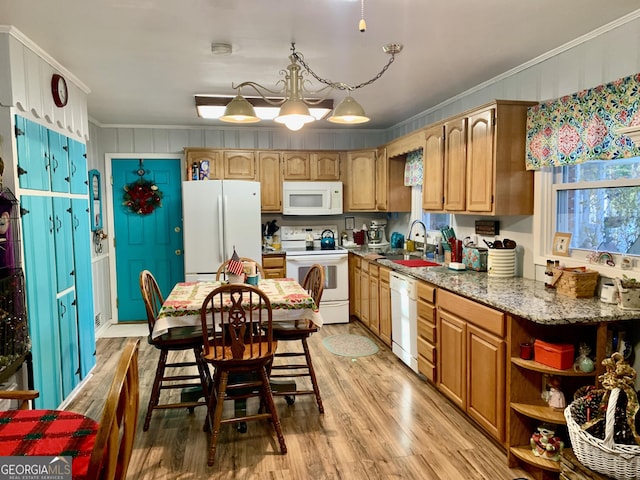 kitchen with light stone countertops, sink, light hardwood / wood-style flooring, white appliances, and ornamental molding