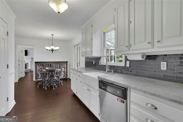 kitchen with dishwasher, sink, dark hardwood / wood-style flooring, pendant lighting, and white cabinets