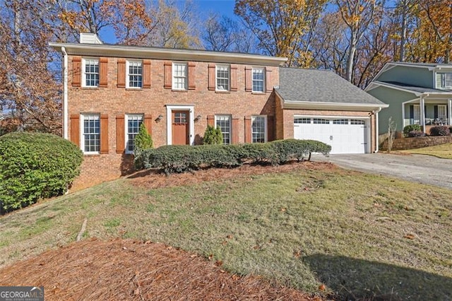 colonial inspired home with a front yard