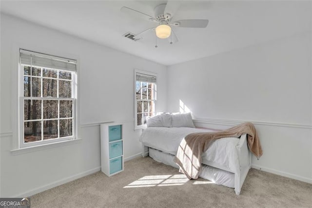 carpeted bedroom with ceiling fan