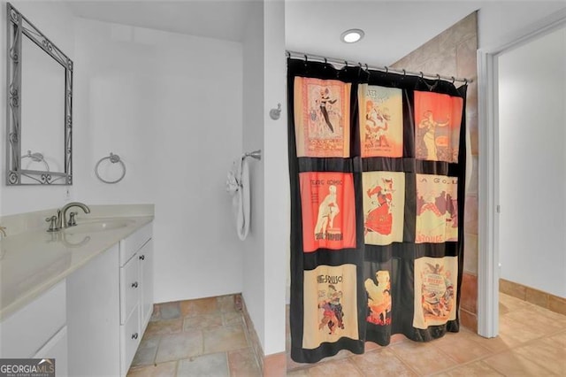 bathroom featuring vanity and a shower with shower curtain