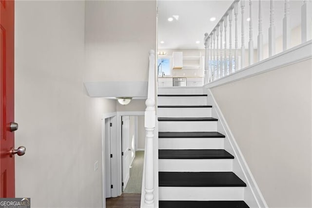 staircase featuring hardwood / wood-style floors