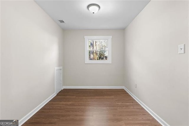 unfurnished room featuring hardwood / wood-style floors