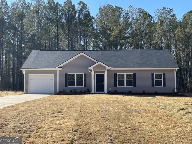 ranch-style home featuring a garage