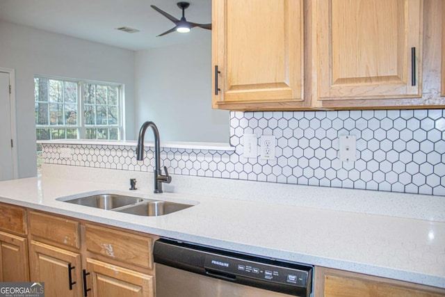 kitchen with ceiling fan, dishwasher, sink, light stone countertops, and backsplash