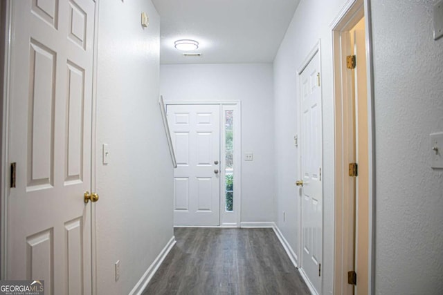 doorway featuring dark hardwood / wood-style flooring