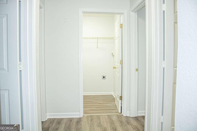 corridor featuring light hardwood / wood-style floors