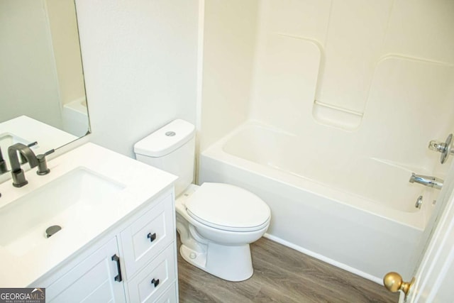 full bathroom featuring wood-type flooring, vanity, toilet, and shower / bathtub combination