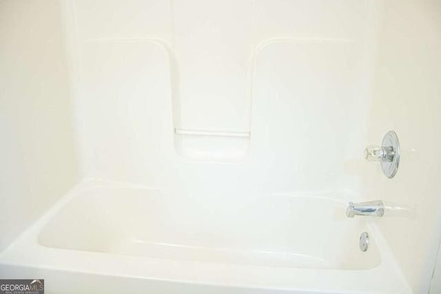 bathroom featuring washtub / shower combination