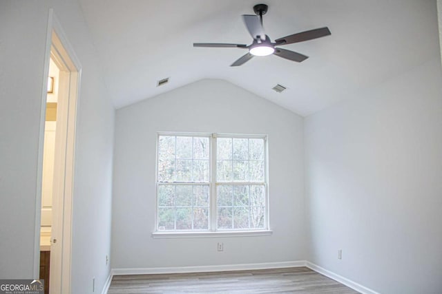 unfurnished bedroom featuring light wood-type flooring, ceiling fan, and lofted ceiling