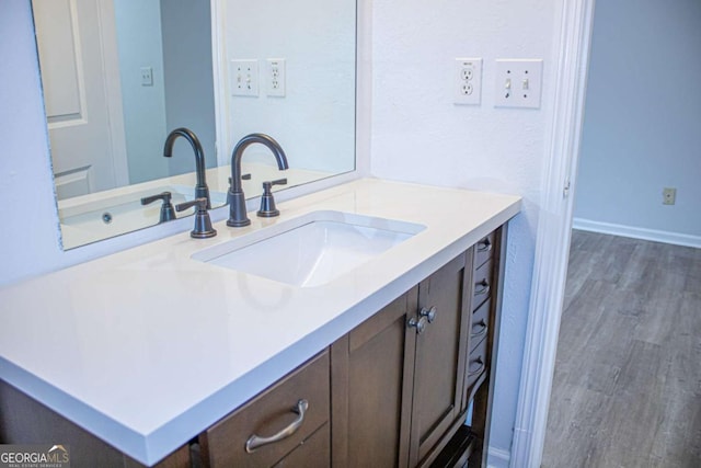 bathroom featuring wood-type flooring and vanity