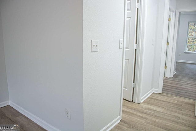 corridor featuring light wood-type flooring