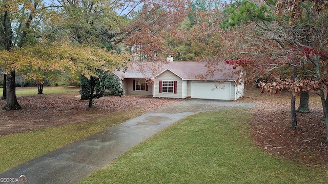 view of front facade with a garage and a front lawn