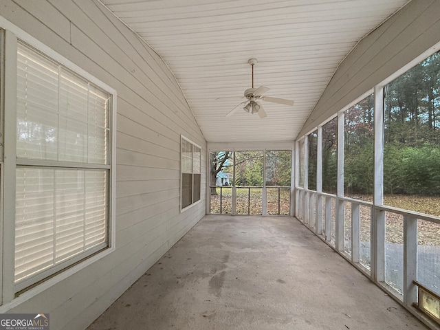 unfurnished sunroom with plenty of natural light, ceiling fan, and lofted ceiling