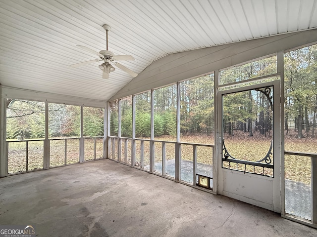 unfurnished sunroom with a healthy amount of sunlight, ceiling fan, and lofted ceiling