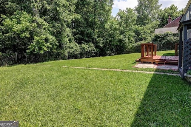 view of yard with a deck