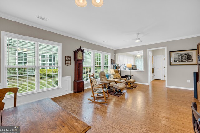 living room featuring ceiling fan, a healthy amount of sunlight, and light hardwood / wood-style floors