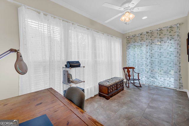 misc room with ceiling fan and ornamental molding