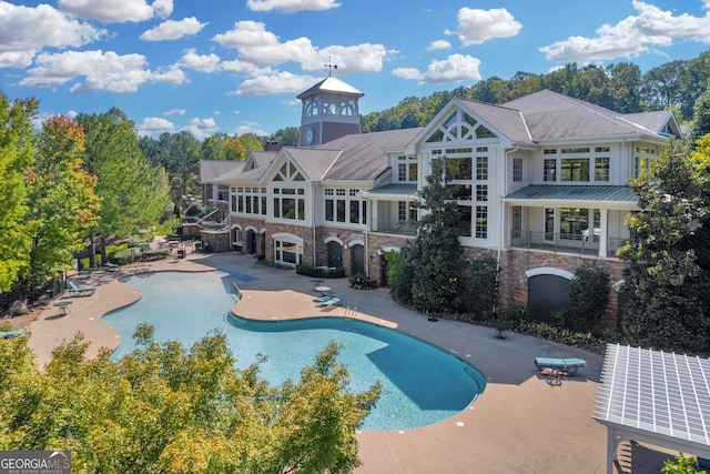 view of swimming pool featuring a patio area