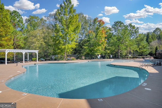 view of swimming pool featuring a pergola and a patio