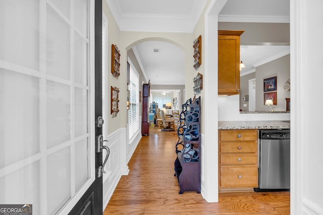 interior space with light hardwood / wood-style flooring and ornamental molding