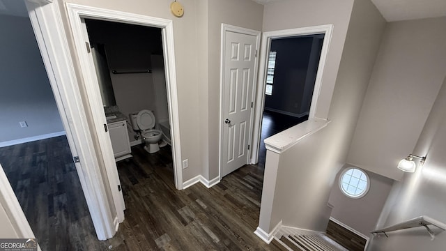 hall with dark hardwood / wood-style floors