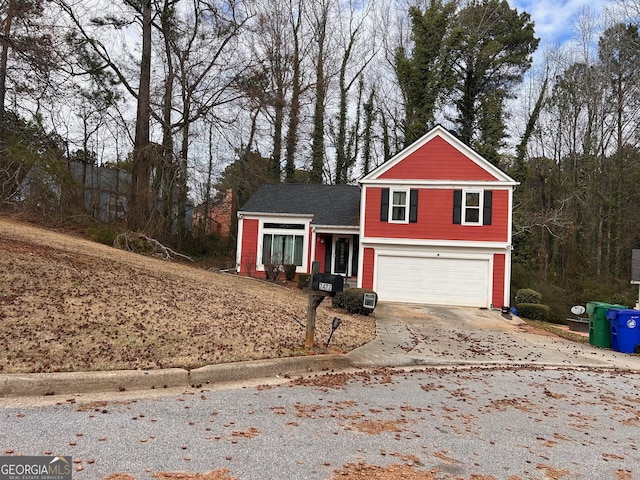 view of front of property with a garage and driveway