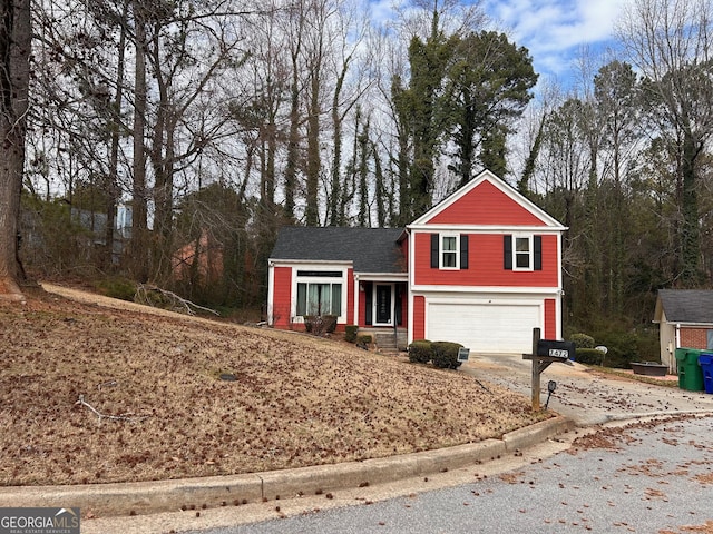 view of front of property featuring a garage and concrete driveway