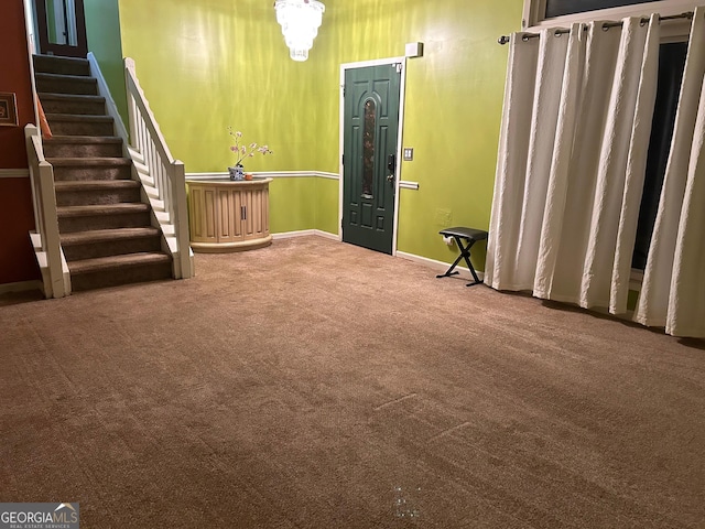 interior space with carpet, stairs, and baseboards