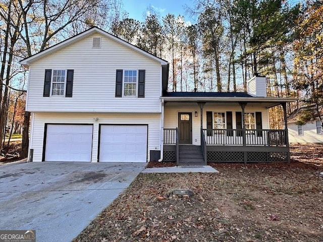 view of front facade with covered porch and a garage