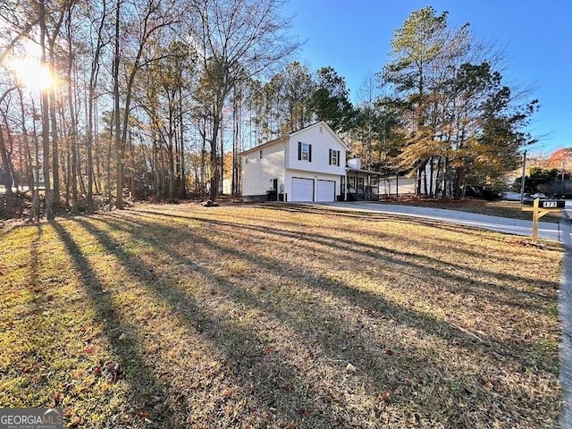 view of yard featuring a garage