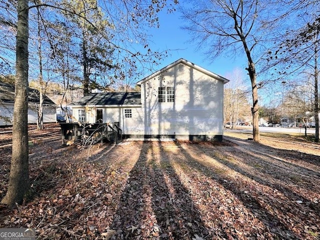 back of property featuring a deck