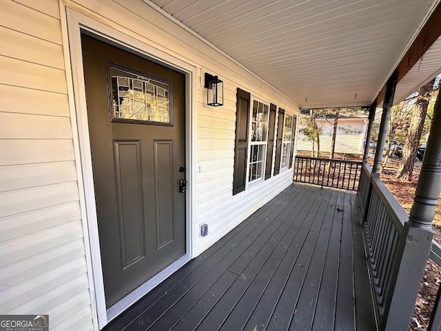 wooden terrace with a porch