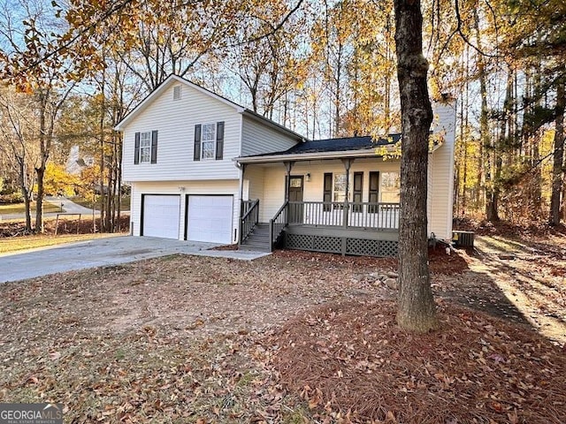 view of front of property with covered porch and a garage