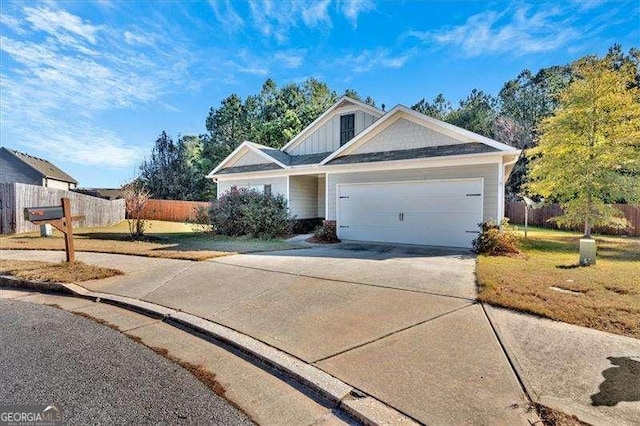 view of front facade with a front yard and a garage