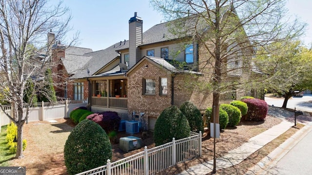 view of side of home featuring central AC